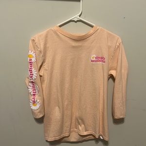 This is a simply southern tee shirt with flowers on the sleeves. It’s cute+comfy